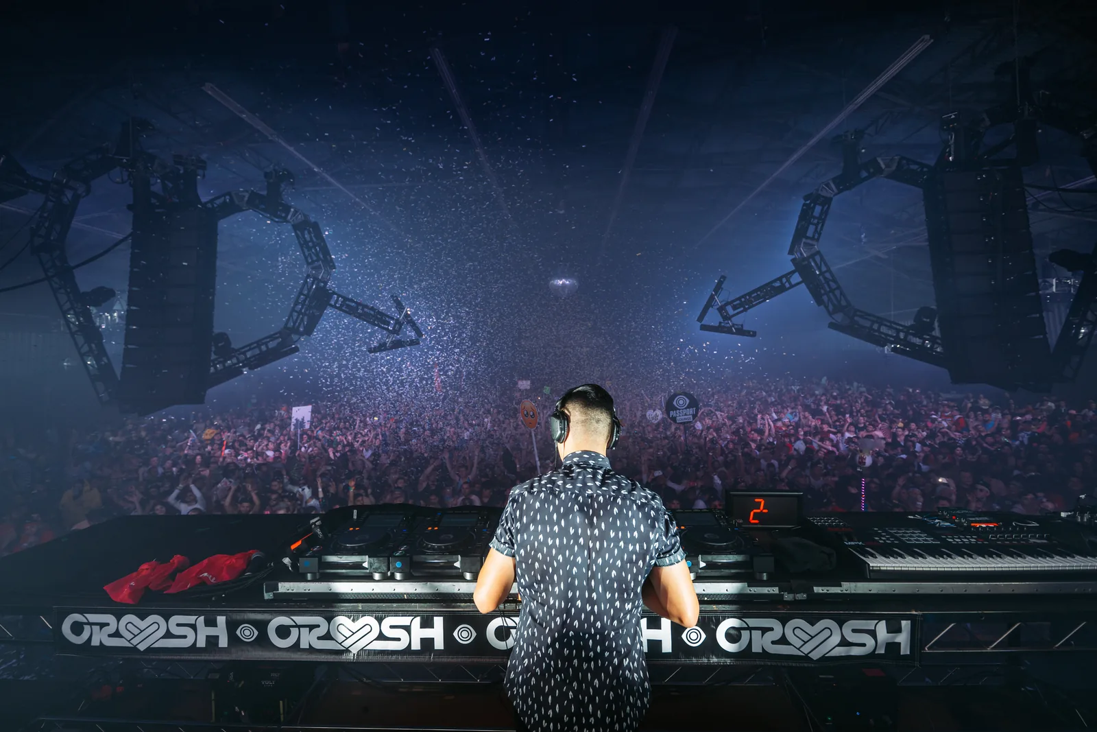 Ravell behind the decks as confetti falls over the crowd